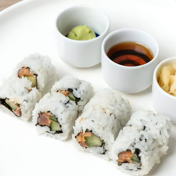 Sushi Totoro's salmon and cucumber sushi rolls with wasabi, soy sauce, and pickled ginger.