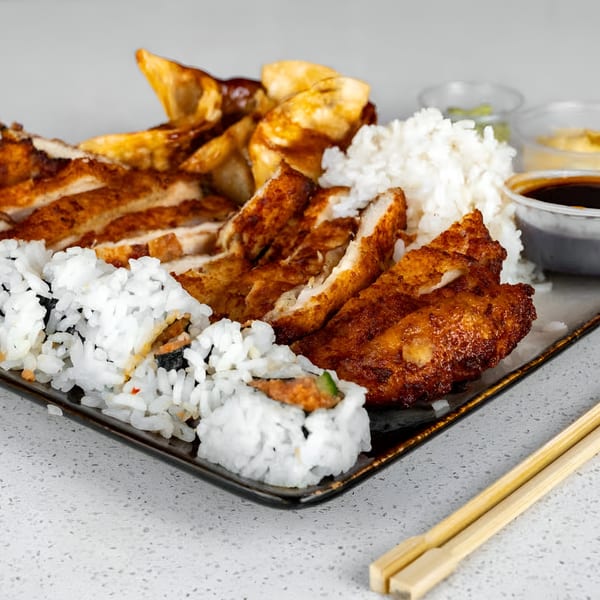 Sushi Totoro's chicken teriyaki, white rice, sushi rolls, and fried plantains with sauces.